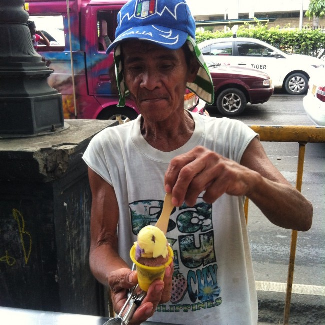 A Mamang Sorbetero scooping some sorbetes. 