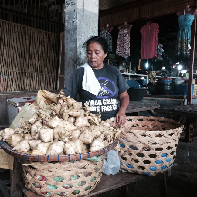 A Puso vendor waiting patiently for customers.