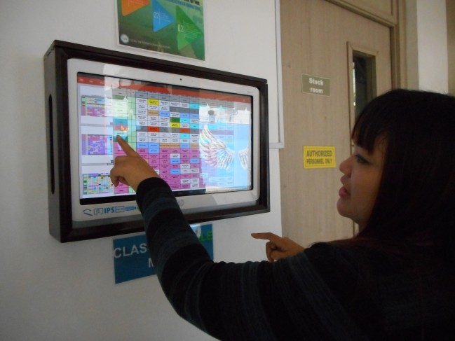 Our tour guide directs us to the different places in the school though the touchscreen directory.