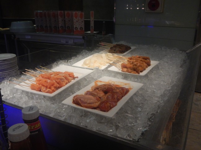 Uncooked meat placed in a pile of ice for preservation. 