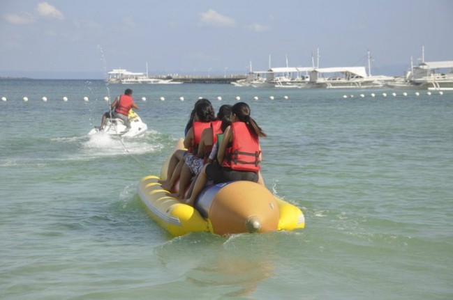My Family and I are riding a Banana Boat against strong winds in Tambuli Resort, Mactan Island , Cebu.