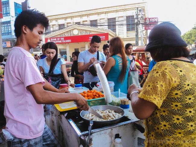Locals enjoying street food.
