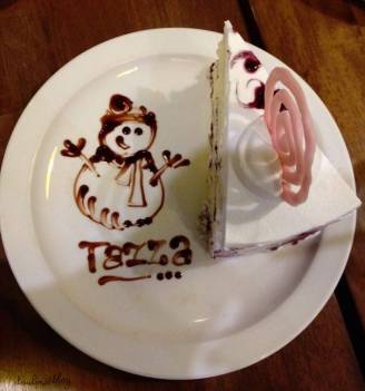 This one is a slice of Blueberry Tres Leches cake with a sketch of a gleeful snowman. :)